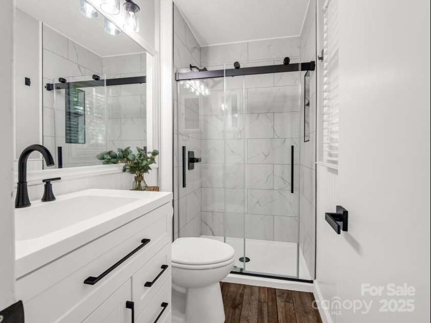 195 White Pine Drive, Lake Lure, NC 28746.  MLS# CAR4266532, YatesRealty ID 17828. Primary bath for the primary bedroom.