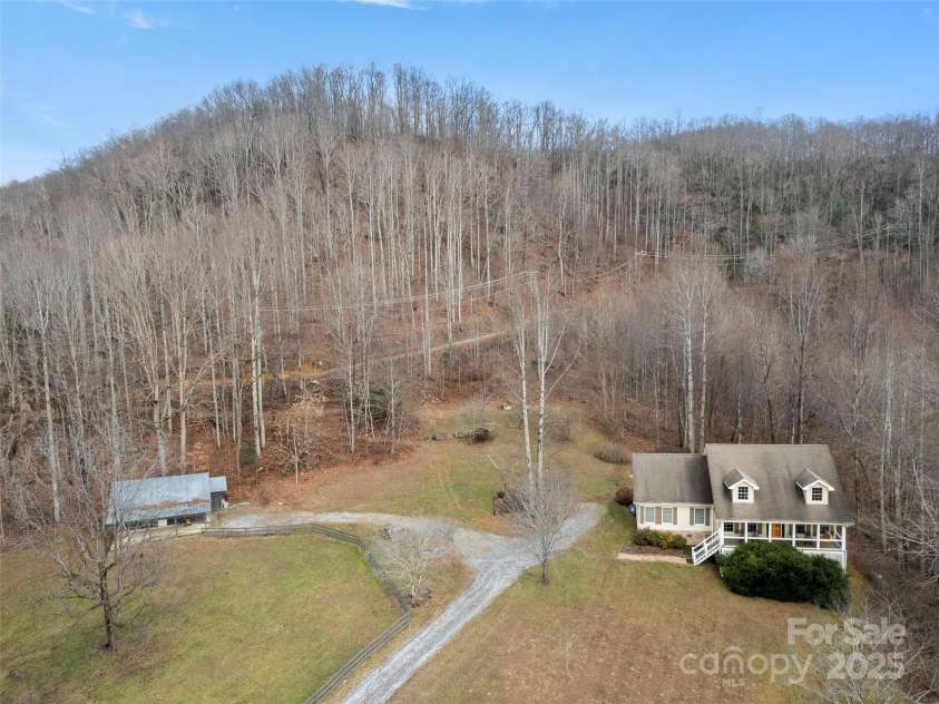 512 Shiloh Drive, Hendersonville, NC 28792.  MLS# CAR4208109, YatesRealty ID 17829. Incredible property with 19 acres, barn, fenced pasture, creek & waterfall!