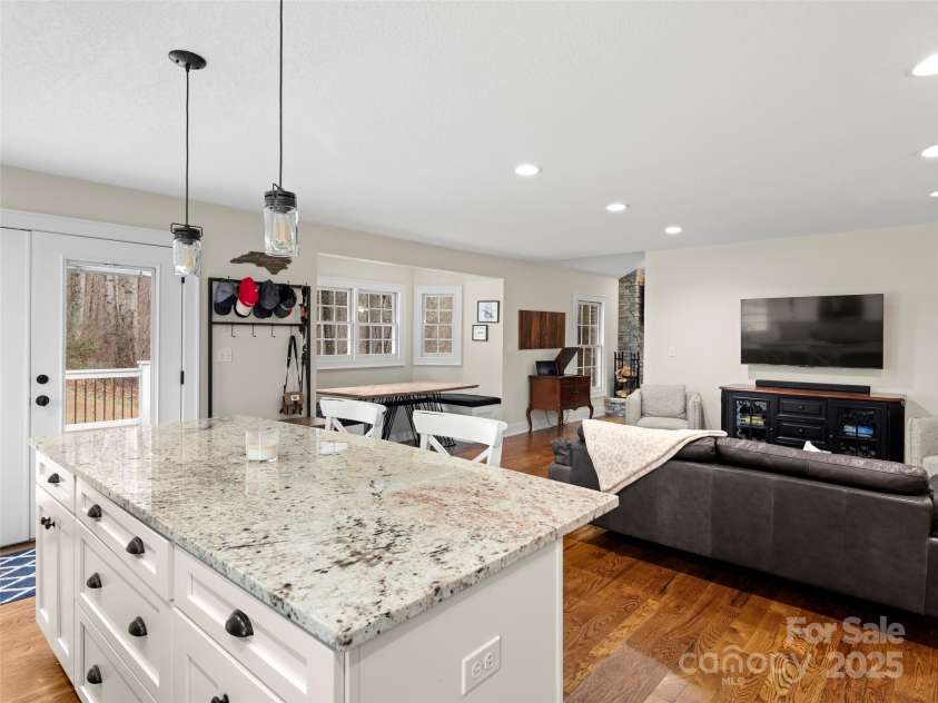512 Shiloh Drive, Hendersonville, NC 28792.  MLS# CAR4208109, YatesRealty ID 17829. Kitchen opens to casual living space