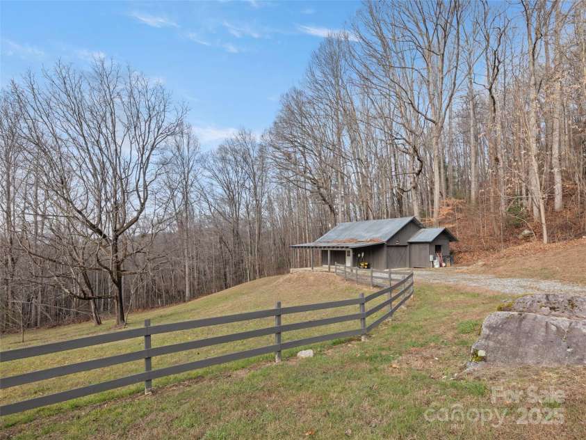 512 Shiloh Drive, Hendersonville, NC 28792.  MLS# CAR4208109, YatesRealty ID 17829. New barn with fenced pasture and a chicken coop