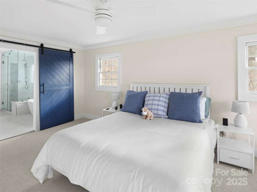 512 Shiloh Drive, Hendersonville, NC 28792.  MLS# CAR4208109, YatesRealty ID 17829. Primary Suite with newly added barn door to renovated primary ensuite bath