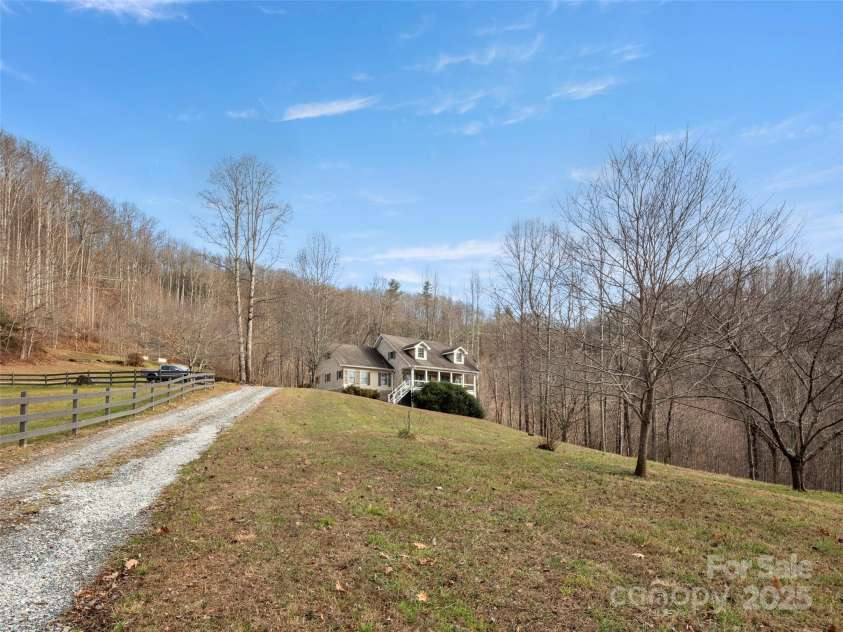 512 Shiloh Drive, Hendersonville, NC 28792.  MLS# CAR4208109, YatesRealty ID 17829. Quaint drive from the main gate to the home