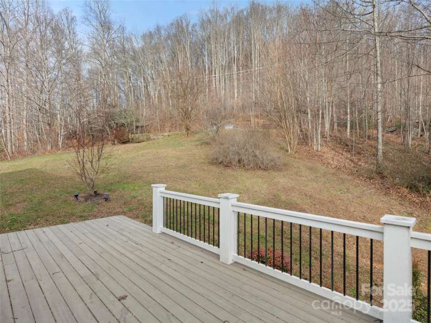 512 Shiloh Drive, Hendersonville, NC 28792.  MLS# CAR4208109, YatesRealty ID 17829. Relaxing outdoor living on the spacious back deck where you can hear the sounds of the creek going by