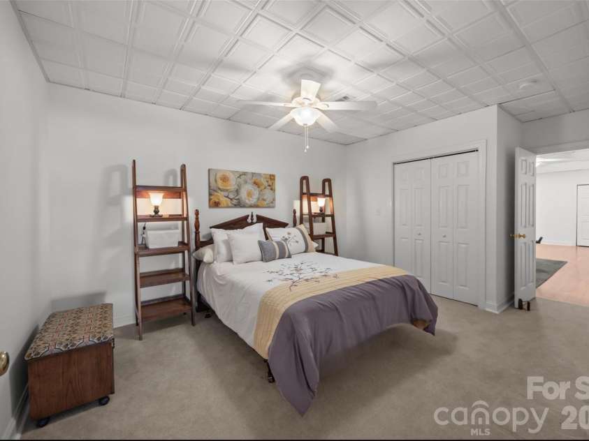 5231 Peninsula Drive, Granite Falls, NC 28630.  MLS# CAR4336540, YatesRealty ID 17834. Bedroom on lower level with access to full bath.