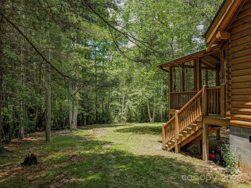 3374 Locust Grove Road, Hendersonville, NC 28792.  MLS# CAR4265087, YatesRealty ID 17837. Backyard and screened in porch