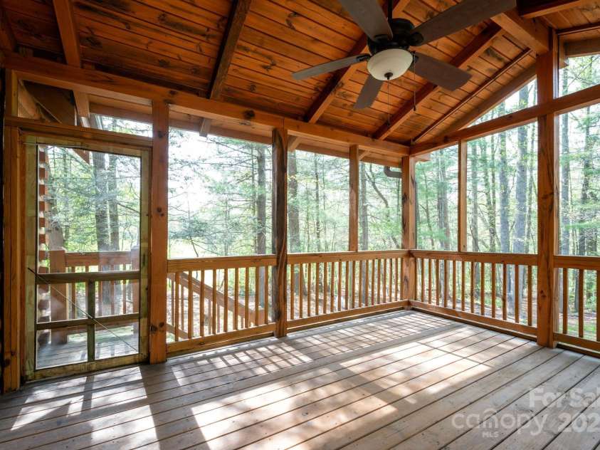 3374 Locust Grove Road, Hendersonville, NC 28792.  MLS# CAR4265087, YatesRealty ID 17837. Screened in back porch looks over expansive back yard