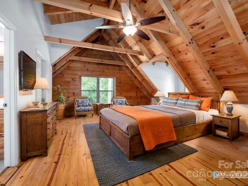 3374 Locust Grove Road, Hendersonville, NC 28792.  MLS# CAR4265087, YatesRealty ID 17837. Upstairs bedroom with vaulted ceilings