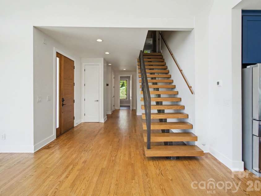 8 Nottingham Drive, Candler, NC 28715.  MLS# CAR4365224, YatesRealty ID 17837. Open-riser staircase which sleek modern look allows light to flow freely
