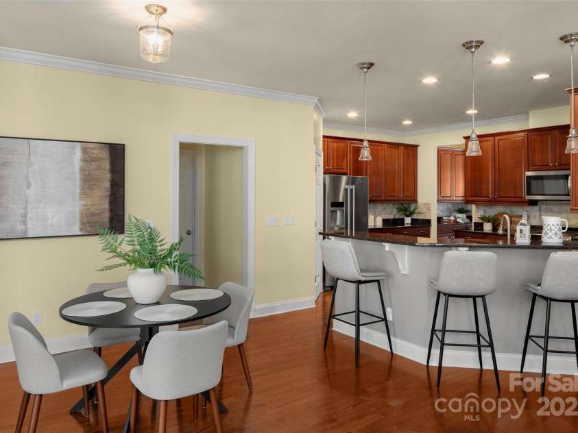 16 La Rue Court, Biltmore Lake, NC 28715.  MLS# CAR4224006, YatesRealty ID 17839. Breakfast bar & adjoining informal dining area.