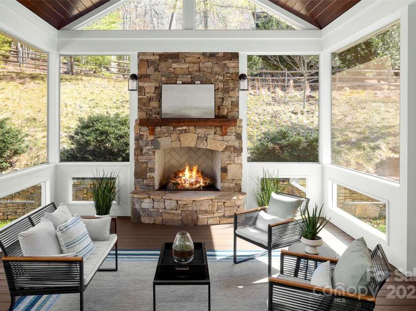 16 La Rue Court, Biltmore Lake, NC 28715.  MLS# CAR4224006, YatesRealty ID 17839. Stunning fireplace focal point in this custom outdoor living dream!