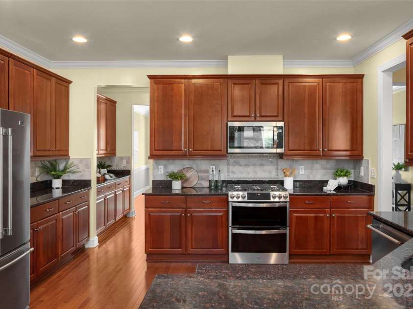 16 La Rue Court, Biltmore Lake, NC 28715.  MLS# CAR4224006, YatesRealty ID 17839. View of kitchen from informal dining area, looking toward butler's pantry