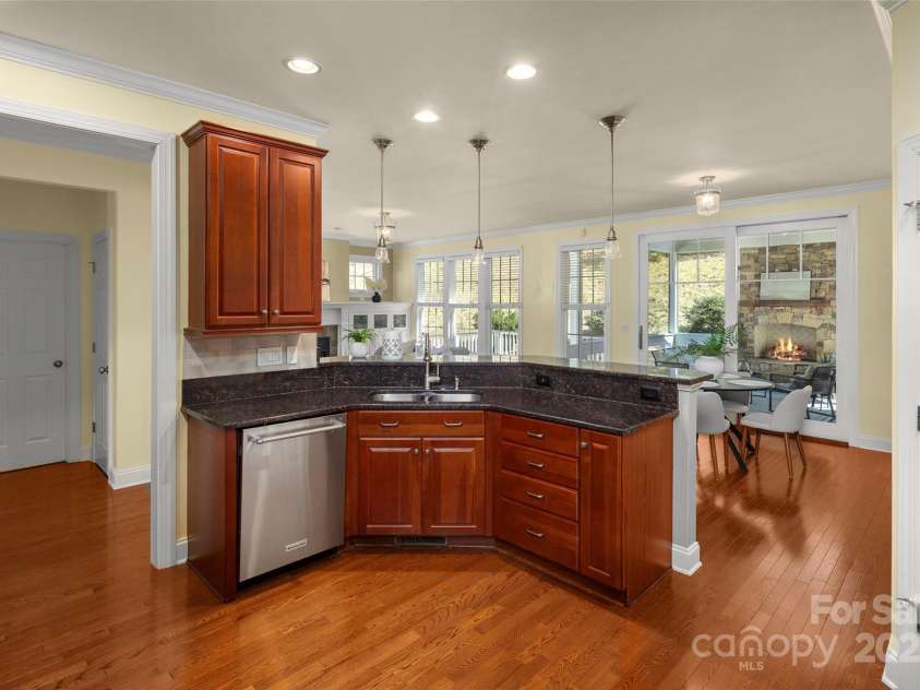 16 La Rue Court, Biltmore Lake, NC 28715.  MLS# CAR4224006, YatesRealty ID 17839. View of kitchen from opposite side of butler's pantry corridor, facing toward family room