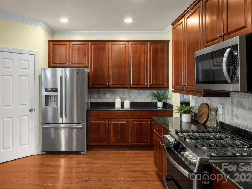 16 La Rue Court, Biltmore Lake, NC 28715.  MLS# CAR4224006, YatesRealty ID 17839. View of kitchen & walk-in pantry, from breakfast bar