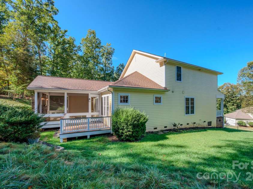 16 La Rue Court, Biltmore Lake, NC 28715.  MLS# CAR4308384, YatesRealty ID 17839. Back of home with deck
