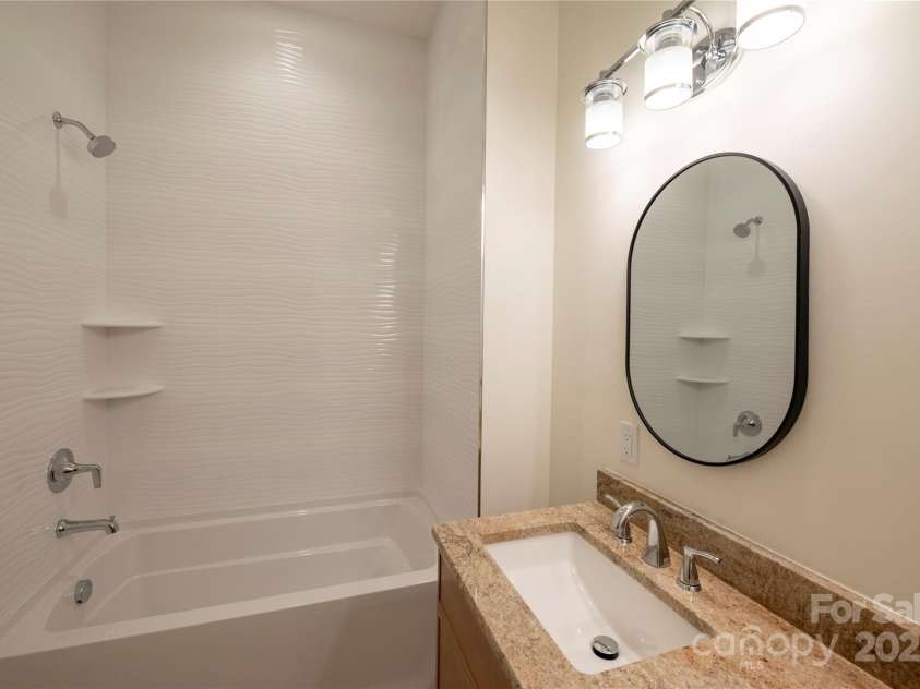 15 Evian Court, Asheville, NC 28804.  MLS# CAR4320178, YatesRealty ID 1784. Guest Bathroom