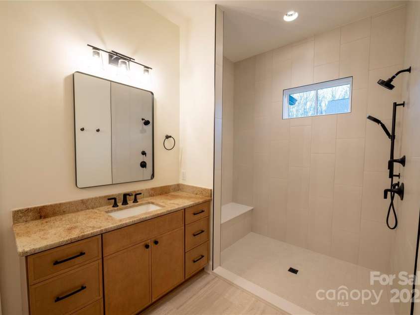 15 Evian Court, Asheville, NC 28804.  MLS# CAR4320178, YatesRealty ID 1784. Primary Bath