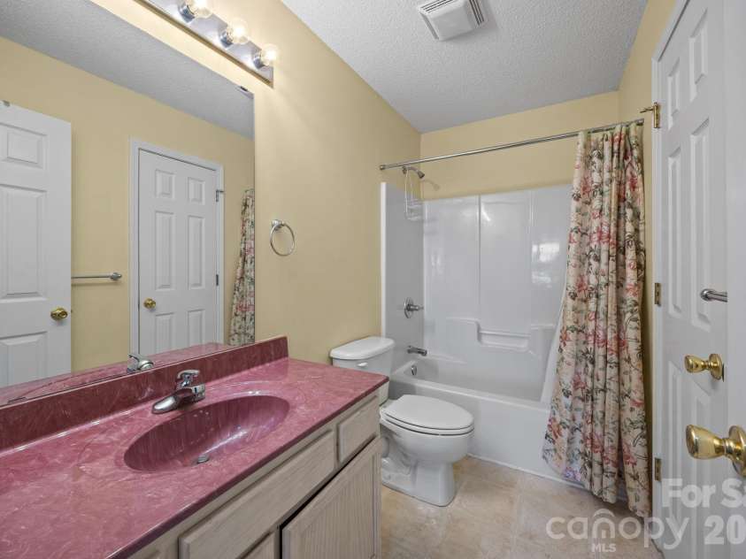 300 Chinaberry Drive, China Grove, NC 28023.  MLS# CAR4346542, YatesRealty ID 1785. Hall bathroom