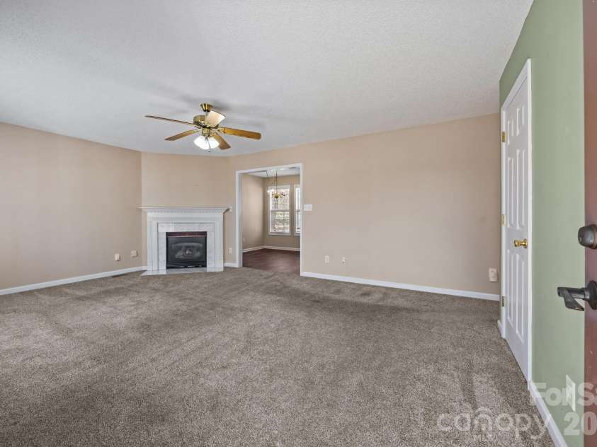 300 Chinaberry Drive, China Grove, NC 28023.  MLS# CAR4346542, YatesRealty ID 1785. Living room looking toward dining area.