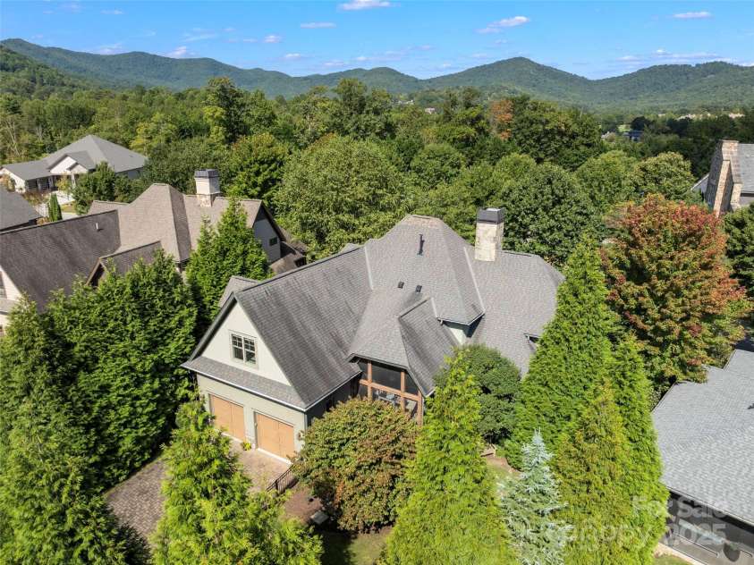 62 Running Creek Trail, Arden, NC 28704.  MLS# CAR4299725, YatesRealty ID 1785. Aerial view of the home from the rear.