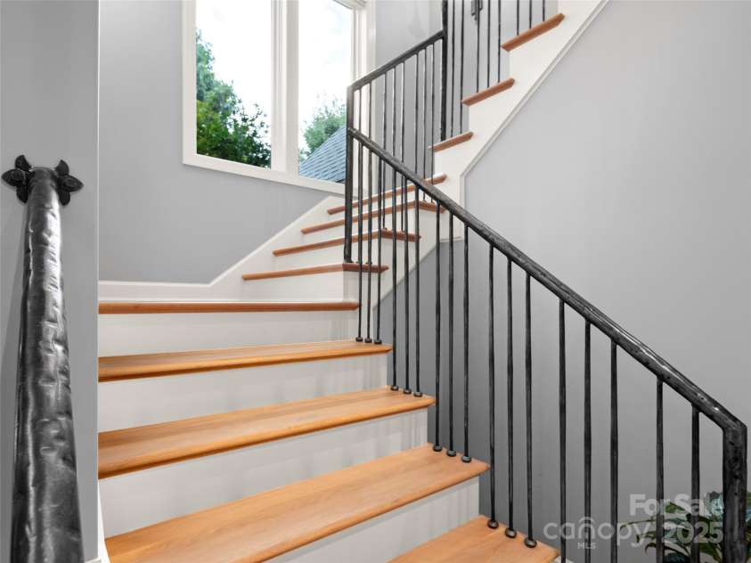 62 Running Creek Trail, Arden, NC 28704.  MLS# CAR4299725, YatesRealty ID 1785. Distinctive, custom wrought-iron railing up the stairs.