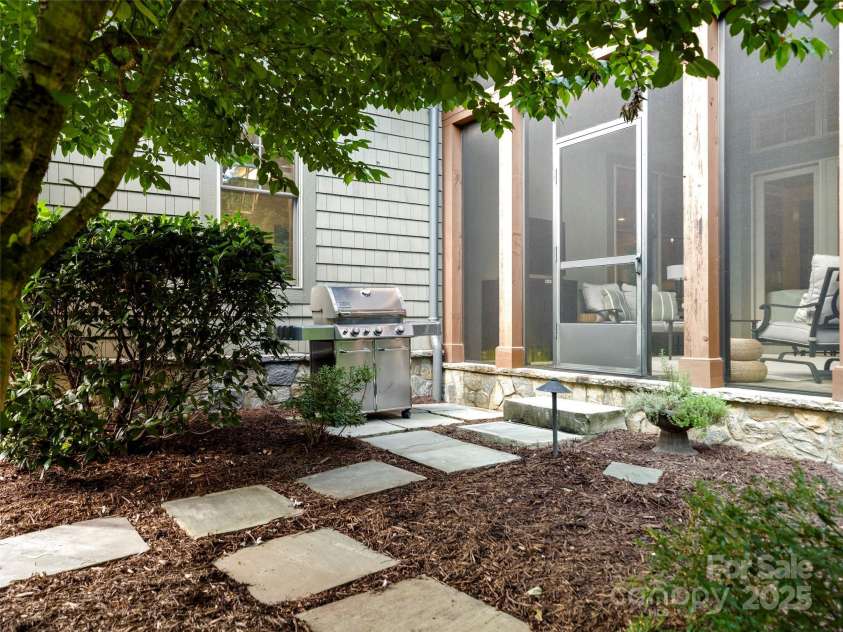 62 Running Creek Trail, Arden, NC 28704.  MLS# CAR4299725, YatesRealty ID 1785. Entrance to screened porch with grill station.  