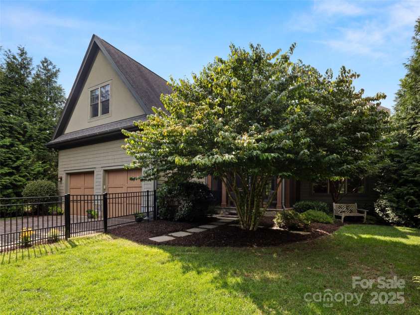 62 Running Creek Trail, Arden, NC 28704.  MLS# CAR4299725, YatesRealty ID 1785. From backyard looking towards rear of house and garage.