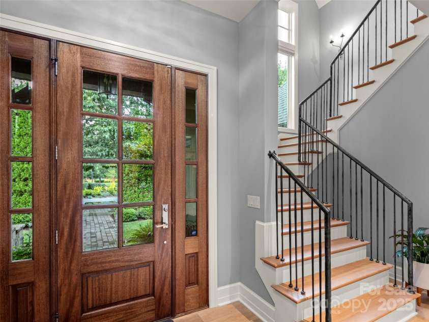 62 Running Creek Trail, Arden, NC 28704.  MLS# CAR4299725, YatesRealty ID 1785. Light and bright front entry with custom wrought iron stair rail.
