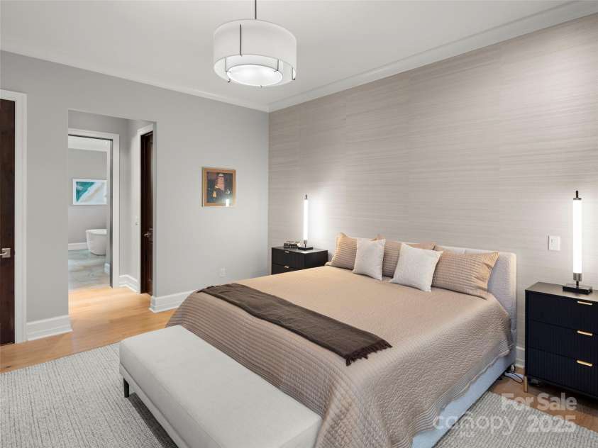 62 Running Creek Trail, Arden, NC 28704.  MLS# CAR4299725, YatesRealty ID 1785. Primary bedroom with access to large primary closet, linen closet and generously sized, spa-like primary bathroom.