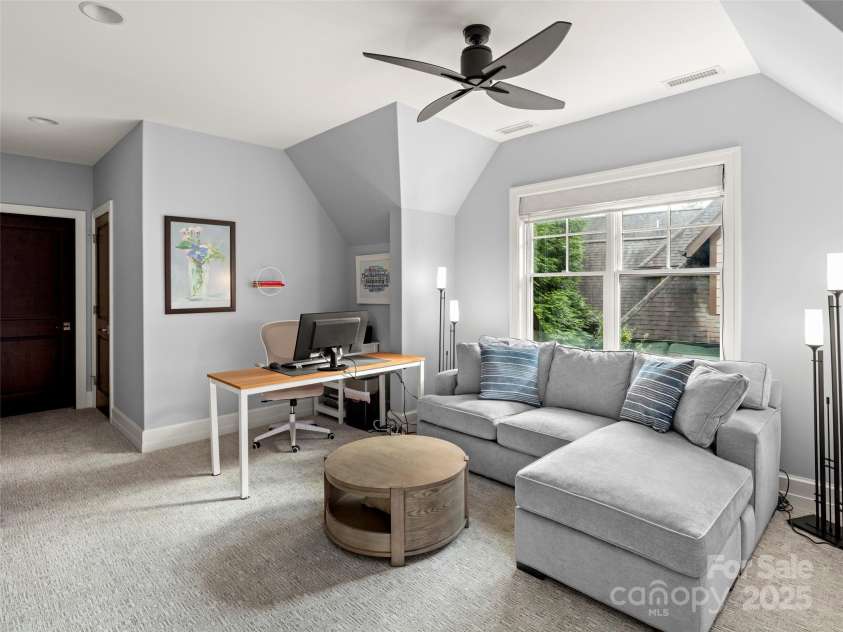 62 Running Creek Trail, Arden, NC 28704.  MLS# CAR4299725, YatesRealty ID 1785. The upstairs den can be used both for watching TV and an office area.  There is hallway access to the bathroom, so this can also be used for occasional overnight guests. 