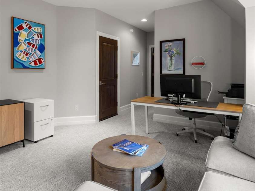 62 Running Creek Trail, Arden, NC 28704.  MLS# CAR4299725, YatesRealty ID 1785. Upstairs den, view towards third bedroom. Door on left is to attic storage.