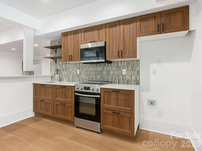 9505 Greyson Ridge Drive, Charlotte, NC 28277.  MLS# CAR4355781, YatesRealty ID 17855. Lower Level Bar/Kitchen 
