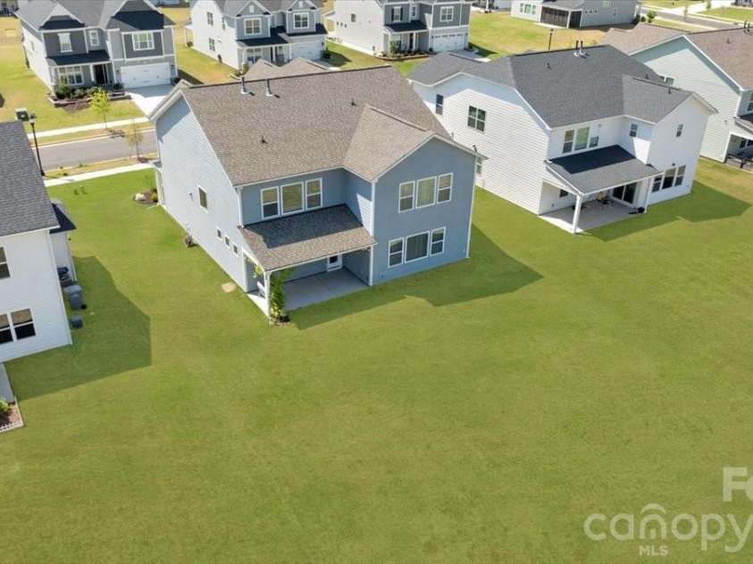 3934 Zinnia Drive, Harrisburg, NC 28075.  MLS# CAR4367243, YatesRealty ID 17857. Grass has been digitally enhanced