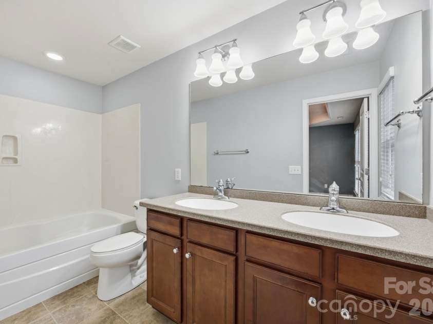 645 Sixth Baxter Crossing, Fort Mill, SC 29708.  MLS# CAR4373614, YatesRealty ID 17860. En suite bathrooom with dual vanity