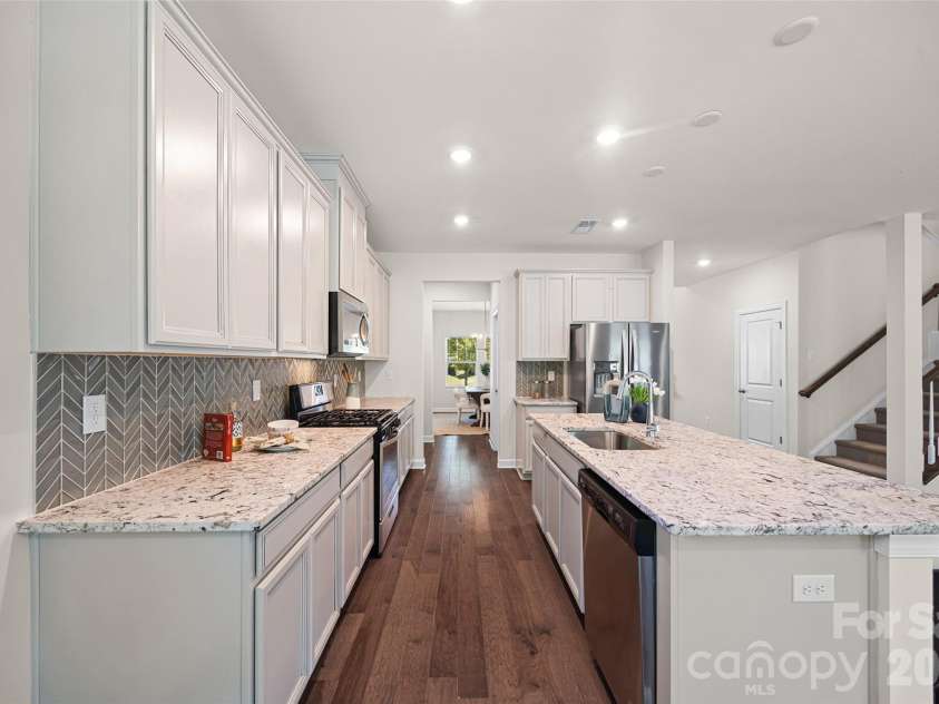 1041 Amberley Crossing Drive, Belmont, NC 28012.  MLS# CAR4373744, YatesRealty ID 17861. Entertaining is made easy with a direct line from kitchen to dining room.