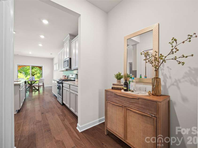 1041 Amberley Crossing Drive, Belmont, NC 28012.  MLS# CAR4373744, YatesRealty ID 17861. Pass-through area from the dining room to the kitchen provides ample space for a wine/coffee bar, or butler's pantry.  Walk-in pantry right across the hall!