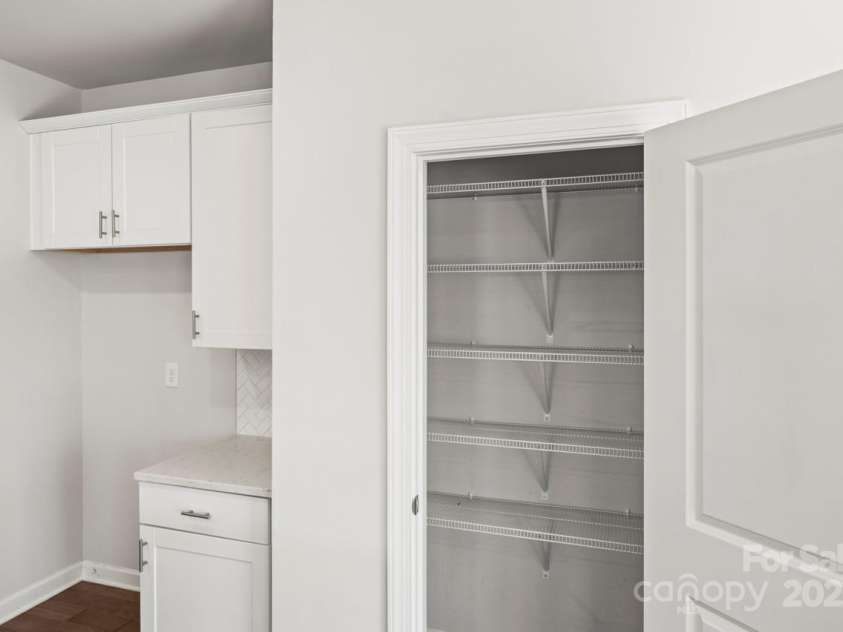 2131 Belterra Drive, Charlotte, NC 28216.  MLS# CAR4228809, YatesRealty ID 1787. Large pantry with extra shelves