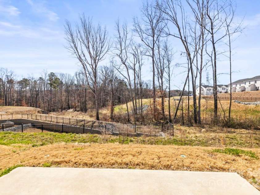 2131 Belterra Drive, Charlotte, NC 28216.  MLS# CAR4228809, YatesRealty ID 1787. Wooded views - this was before the summer leaves filled in