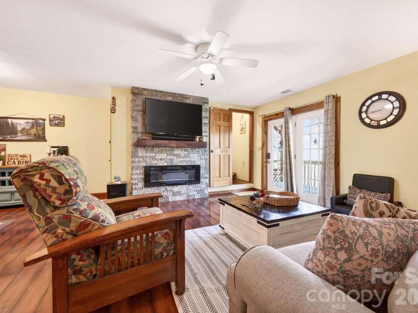 8 Blue Sky Drive, Leicester, NC 28748.  MLS# CAR4359937, YatesRealty ID 17871. Electric fireplace in lower level