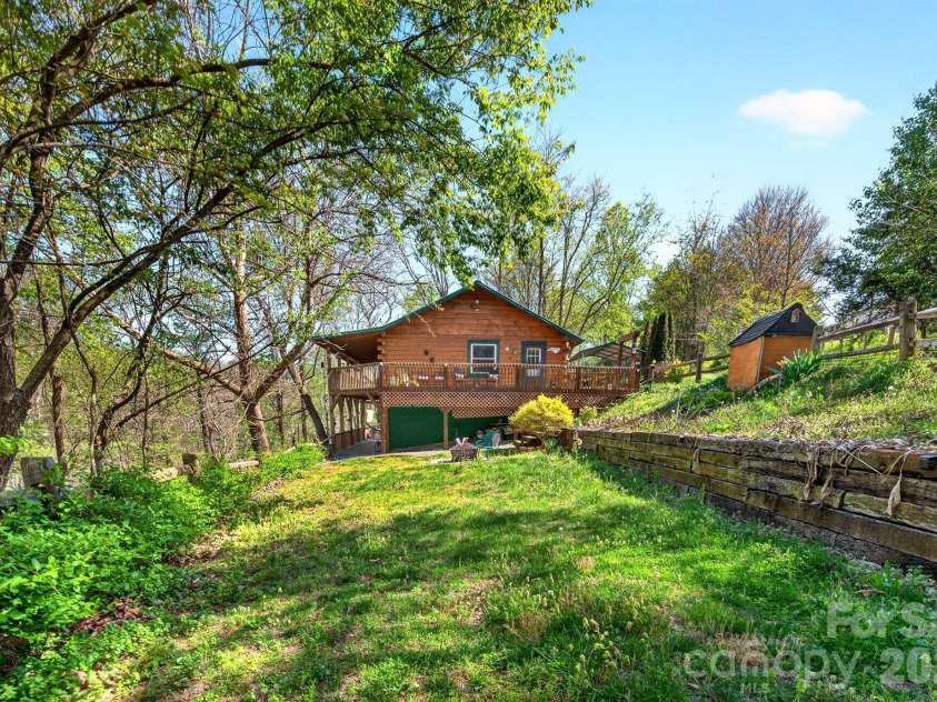 8 Blue Sky Drive, Leicester, NC 28748.  MLS# CAR4359937, YatesRealty ID 17871. Level Side Yard Great for Pets and Play