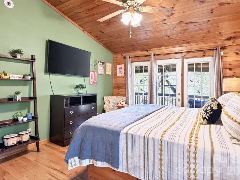 8 Blue Sky Drive, Leicester, NC 28748.  MLS# CAR4359937, YatesRealty ID 17871. Primary Bedroom has French Doors to Deck