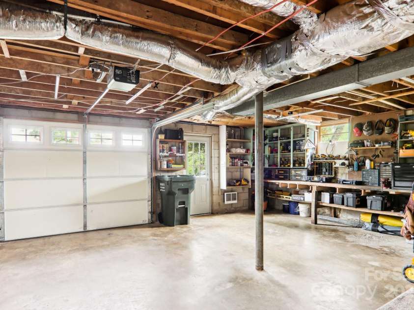 68 Broyles Road, Hendersonville, NC 28791.  MLS# CAR4263952, YatesRealty ID 17872. Garage with Workspace
