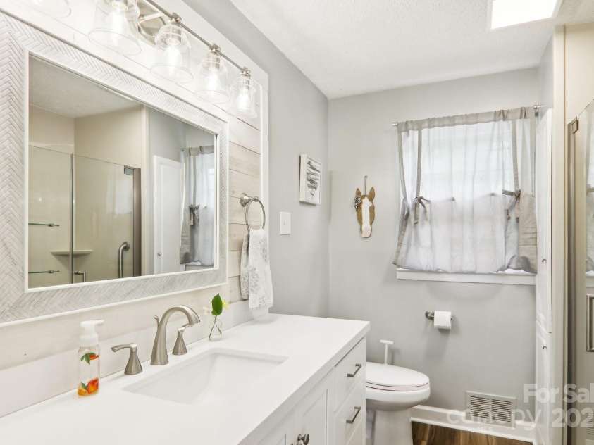 68 Broyles Road, Hendersonville, NC 28791.  MLS# CAR4263952, YatesRealty ID 17872. Updated Guest Bathroom