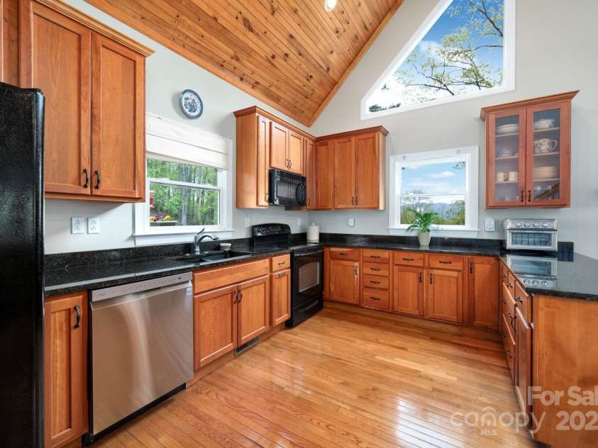 69 Heslar Way, Marshall, NC 28753.  MLS# CAR4246507, YatesRealty ID 17875. Light-filled windows with mountain views