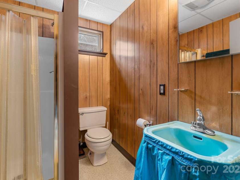 2650 Secluded Valley Road, Marshall, NC 28753.  MLS# CAR4324668, YatesRealty ID 1788. Lower level bathroom