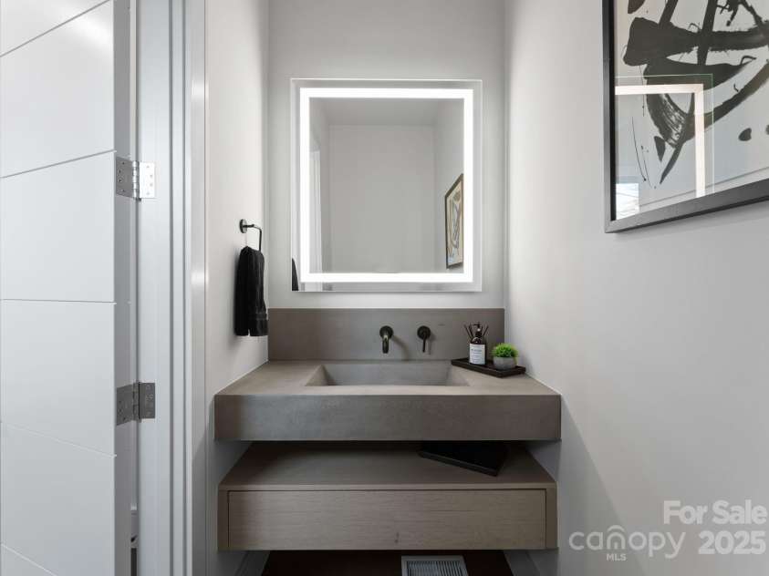 2103 Cortelyou Road, Charlotte, NC 28211.  MLS# CAR4214661, YatesRealty ID 17880. 1 of 2 Main Level Half Bathrooms with Custom Floating Sink