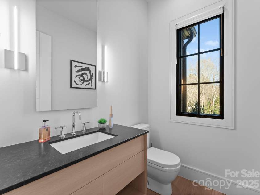 2103 Cortelyou Road, Charlotte, NC 28211.  MLS# CAR4214661, YatesRealty ID 17880. 2nd Main Level Half Bathroom by Primary Bedroom 