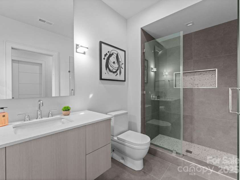 2103 Cortelyou Road, Charlotte, NC 28211.  MLS# CAR4214661, YatesRealty ID 17880. En-Suite Guest Bathroom 