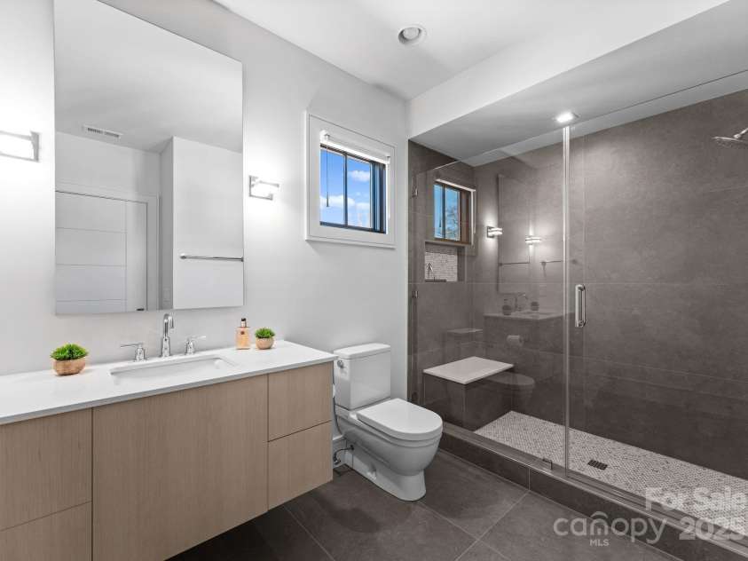 2103 Cortelyou Road, Charlotte, NC 28211.  MLS# CAR4214661, YatesRealty ID 17880. En-Suite Guest Bathroom 