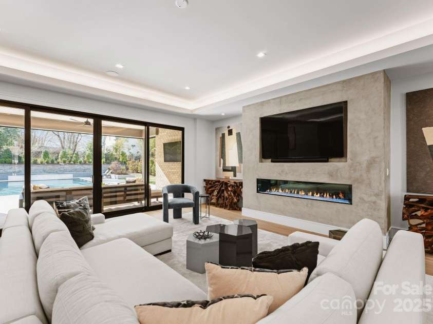 2103 Cortelyou Road, Charlotte, NC 28211.  MLS# CAR4214661, YatesRealty ID 17880. Living Room overlooking Pool Deck 