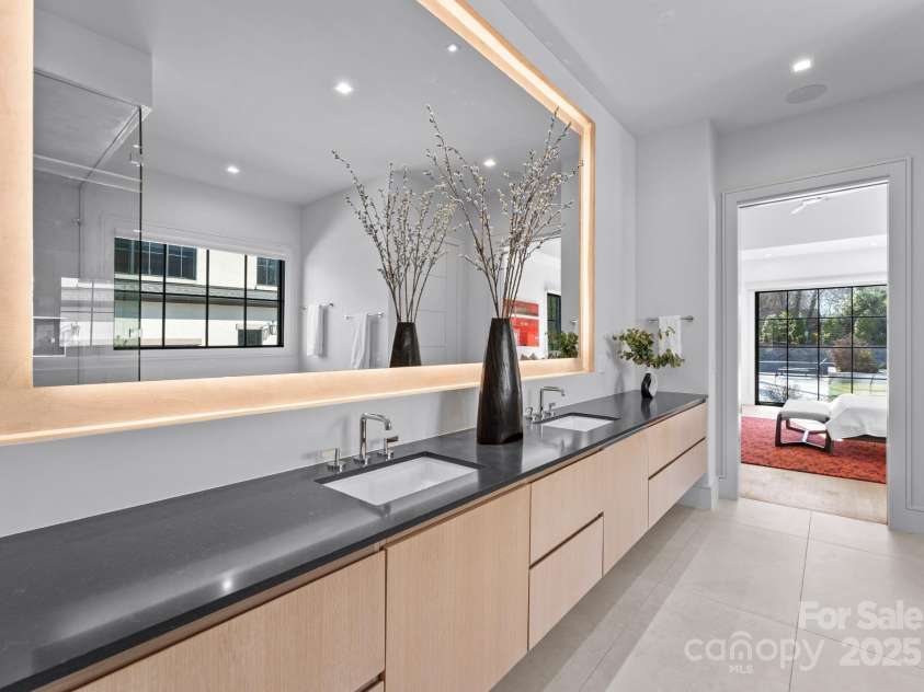 2103 Cortelyou Road, Charlotte, NC 28211.  MLS# CAR4214661, YatesRealty ID 17880. Primary Bathroom and Large Custom Walk-In Closet with Stackable Washer/Dryer